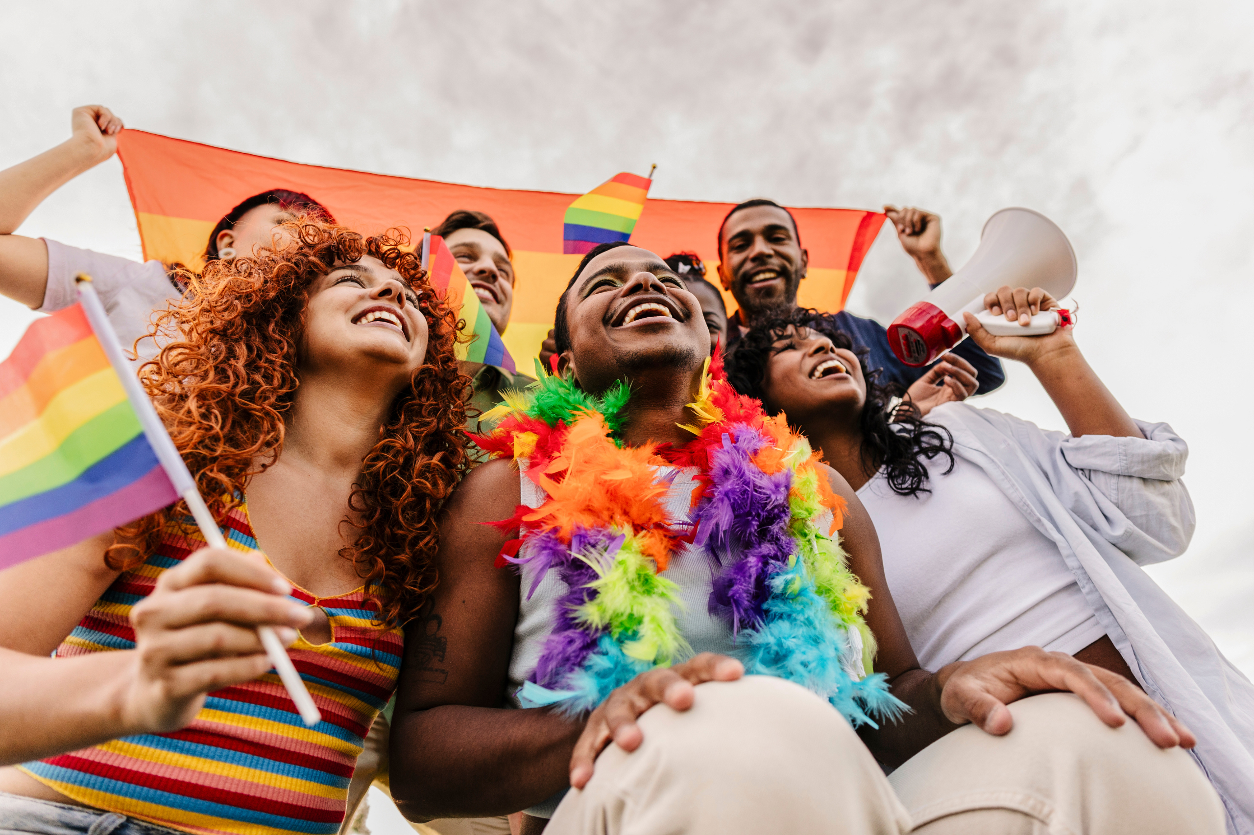 LGBTQ community celebrating pride with rainbow flags and joy